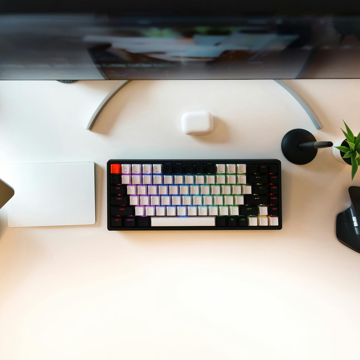 Low monitor stand in an organised workspace