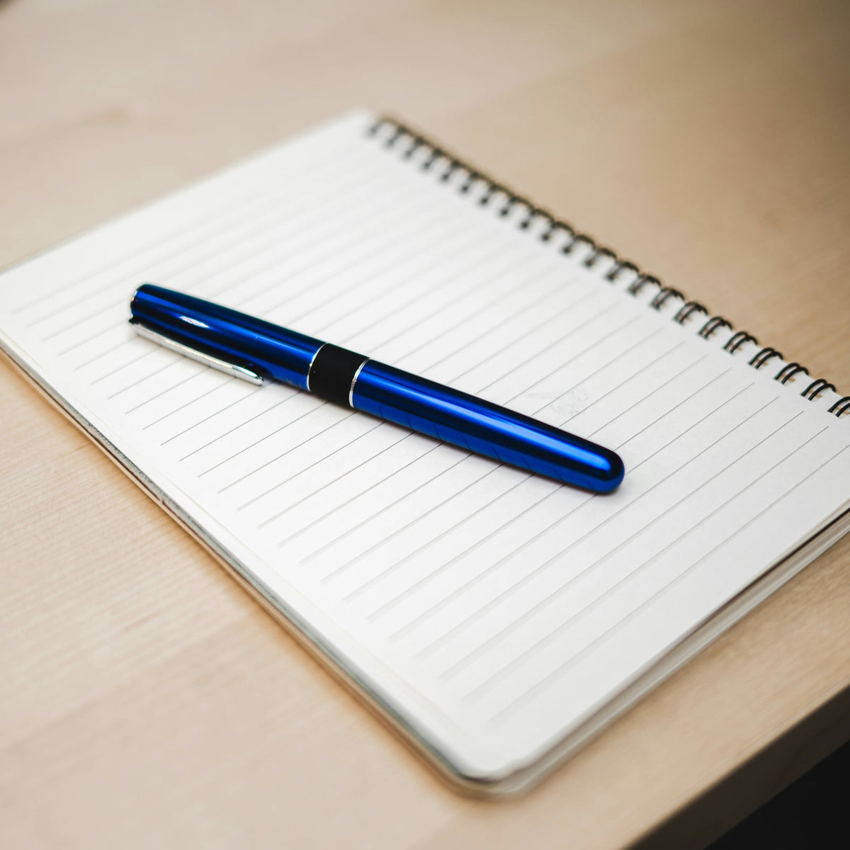 Operator notebook with pen on a clean desk